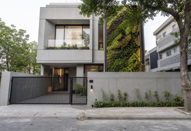 10 Marla minimalist house design with illuminated vertical garden panel, Model Town Lahore