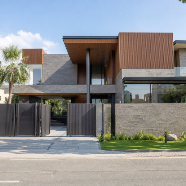 1 Kanal tropical modern house design with stone, wood and cantilevered overhang, Bahria Town Karachi