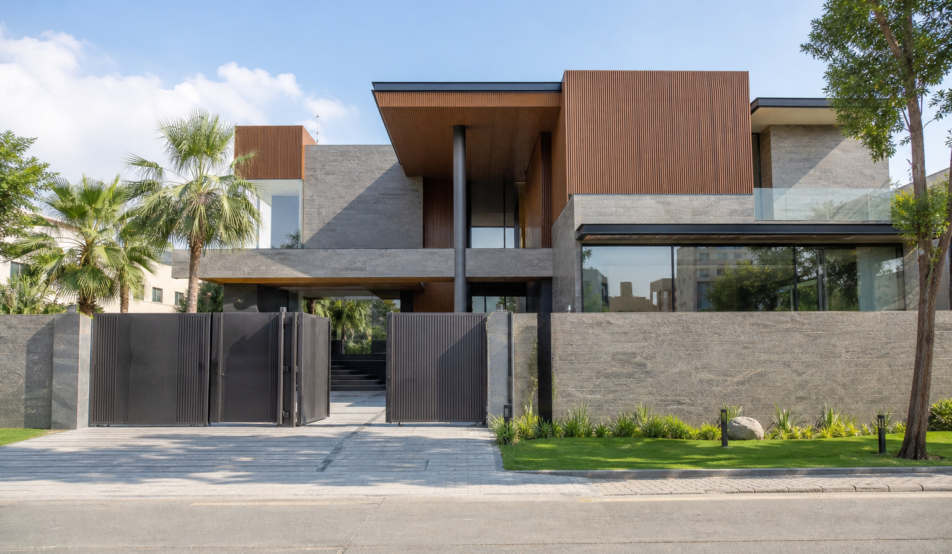 1 Kanal tropical modern house design with stone, wood and cantilevered overhang, Bahria Town Karachi